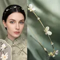 Cerchietto a farfalla dorato con pietre di opale bianche e strass per uno stile elegante - Principessa Farfalla Occhio Di Gatto