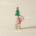 Wooden Christmas cat figurine holding a green tree with a red polka dot scarf - Cat with Tree