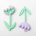 Detail view of mint green and lavender purple tulip flower charms for DIY jewelry making - Lavender