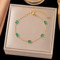 Golden fine chain bracelet featuring five rectangular green stones with adjustable clasp - Gold 5-Green Zirconia Bracelet (SLE13)