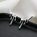 Sleek silver lava style liquid metal stud earrings on silk background - Irregular Lava Earrings / Silver