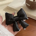 Elegant black satin bow hair tie with sparkling heart-shaped rhinestone details - Black