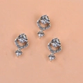 Three silver nail charms with sparkling AB rhinestones on a soft pink background - Silver Base Rhinestone Pendant Accessory