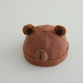 Detailed view of baby miki hat with cute bear ears and nose on brown cotton fabric - 48-50cm (6 Months-2 Years) / Caramel color