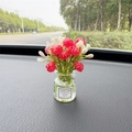 Red and white artificial flowers in a glass vase car dashboard ornament with Good Luck label - Red Jasmine
