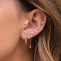 Detailed view of women wearing gold butterfly and star stud earrings with tassel chain - Earring Set (TZ00008)