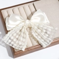 Creamy white oversized bow hair clip featuring satin and star pattern lace detail - Star Lace Bow / Off White