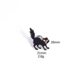 Detail of black cat enamel pin with yellow eyes and silver trim measuring 26mm by 21mm - Black Cat