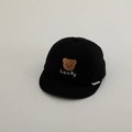 Detail of embroidered bear and Lucky text on a black cotton baby baseball cap - 50cm 1-2 Years / Black