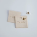 Beige velvet envelope jewelry pouches with embossed logo and gold pearl earrings - Beige