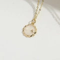 Gold birthstone necklace featuring a sunburst star pendant on a dainty cable chain - Pentagram