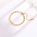 Elegant gold titanium steel bracelet with embossed round discs and adjustable extension chain - Embossed Round Plate Style