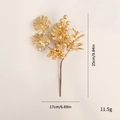Artificial gold Christmas branch with monstera leaves and berries for holiday decor - Golden Leaves and Berries Branch