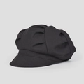 Vue détaillée du tissu en maille texturé et des plis de cette casquette gavroche noire - M (56-58cm) / Noir