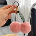 Pink faux rabbit fur cherry keychain with green leaves and gold metal ring - Dusty Pink
