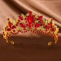 Macro detail of luxury baroque gold tiara with red crystals and intricate floral patterns - Gold Red Stone