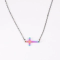 Macro detail of rainbow polished stainless steel horizontal cross pendant necklace - Rainbow