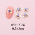 Macro view of 9.5x8mm bowknot alloy nail charms with purple heart rhinestones - Gold Bow + Purple Blue Heart Stone (9985)