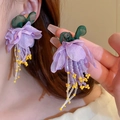 Detail of floral tassel earrings with purple fabric petals and beaded fringes on model - Purple Fabric Flower Tassel (8#)