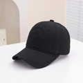 Detail of a black cotton baseball cap showing six-panel stitch and curved brim texture - 54cm (3-8 Years) / Solid Black