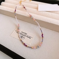Detailed view of agate and pearl beaded necklace with lobster clasp in a jewelry box - White Light Purple Bamboo Joint Faux Stone Necklace (#63)