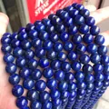 Macro detail of dyed lapis lazuli round beads showing rich blue color and golden flecks - Natural Lapis Lazuli Dyed / 4mm (approximately 90 Beads) 38cm Long