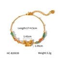 Detailed view of a gold beaded butterfly bracelet with green and orange beads and specs - Butterfly Pendant Style (HC-B20039)