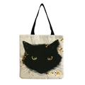 Close-up of artistic black cat print on beige canvas tote bag with sharp fabric texture - Artistic Black Cat
