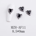 Macro detail of gothic silver heart nail charm with black gem and wing carving - Black Gem Color Heart with Wings (AF11)