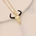 Detailed view of bull skull pendant with gold finish and black horns on marble - Gold Bull Skull with Black Horns Style (23#)