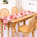 Christmas table runner with red and white plaid pattern and fringes on wooden table - Heart