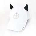 Detail of white baseball cap with black devil horns and silver metal rings on the brim - Airplane White