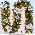 Classic green Christmas garland with white poinsettias and warm LED light string - 1.5m / White Rattan (with Lights)