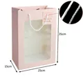 Pink gift bag with 35x25x15cm size, transparent window, and white rope handles - Large Rectangular Pink 35*25*15