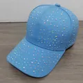 Close-up of sparkling colorful rhinestones on a sky blue cotton baseball cap surface - Denim Blue