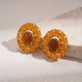Macro view of vintage gold sunflower earrings with amber gemstones on a textured stone - Oval Sunflower Style / Silver Pin - Coffee