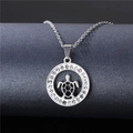 Macro detail of silver sea turtle pendant with crystal pavé on a dark jewelry stand - NZ11 Sea Turtle Hollow