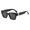 Detail of square sunglasses featuring marble patterns and a gold H-shaped metal hinge - Black Frame Marble Temple Black Grey Lens