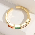 Detail of 14K gold plated ring featuring sunset orange, emerald, and lilac gemstones - Rectangular Zirconia Style / Gold/Multicolor