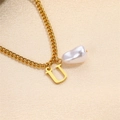 Golden Cuban chain necklace featuring a baroque pearl and letter U pendant detail - Letter U Necklace