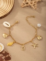 Golden ocean charm bracelet featuring sea shells, starfish, and a white pearl pendant - Letter D(D)