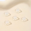 Macro detail of transparent silicone butterfly earring backs for DIY jewelry making - Clear