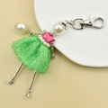 Detail of handmade doll keychain with green mesh dress, pearl accents, and lobster clasp - 07-Green Plaid Dress Girl