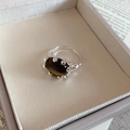 Detailed view of oval tiger eye stone with hand-hammered silver texture open ring - Oval Open Ring / Tiger Eye Brown/Silver Color