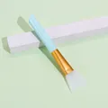 Light blue silicone face mask brush with gold ferrule and white soft flat spatula tip - Blue