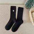 Black Christmas crew socks with colorful speckles and a Santa Claus embroidery detail - Black