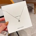 Detail of silver S925 sterling silver chain featuring a square micro-pave diamond pendant - Silver (Pave Round Pendant)