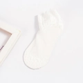 White lace mesh crew socks with decorative wavy cuff and delicate floral patterns - Bare Socks / White