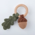 Handmade crochet baby teether ring featuring a green oak leaf and brown acorn - Nut in Ring