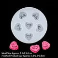 Silicone mold for 6 heart-shaped bow crafts with pink resin samples on black background - 1# Heart Bow / Clear